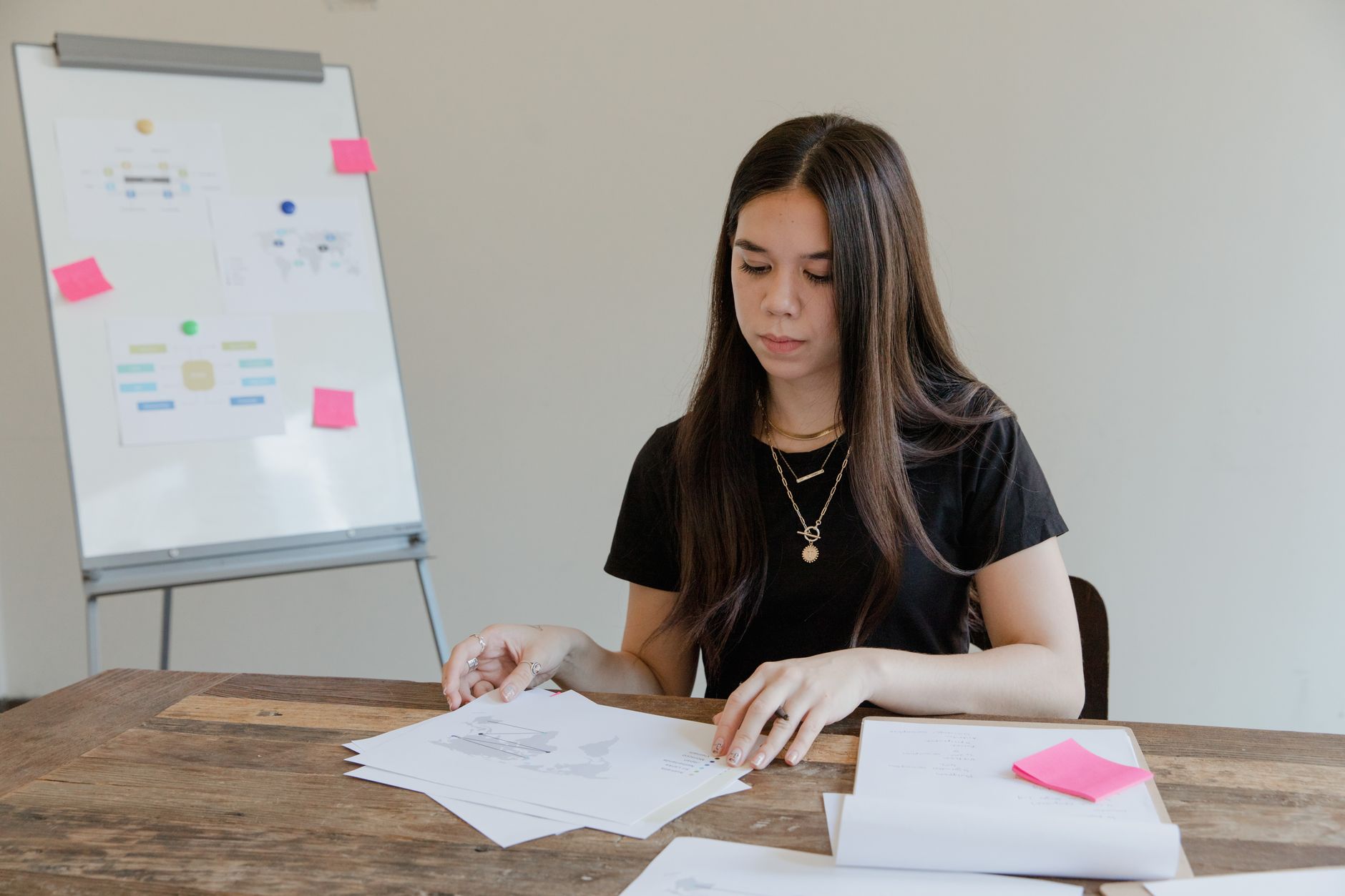 small business owner reviewing advertising documents