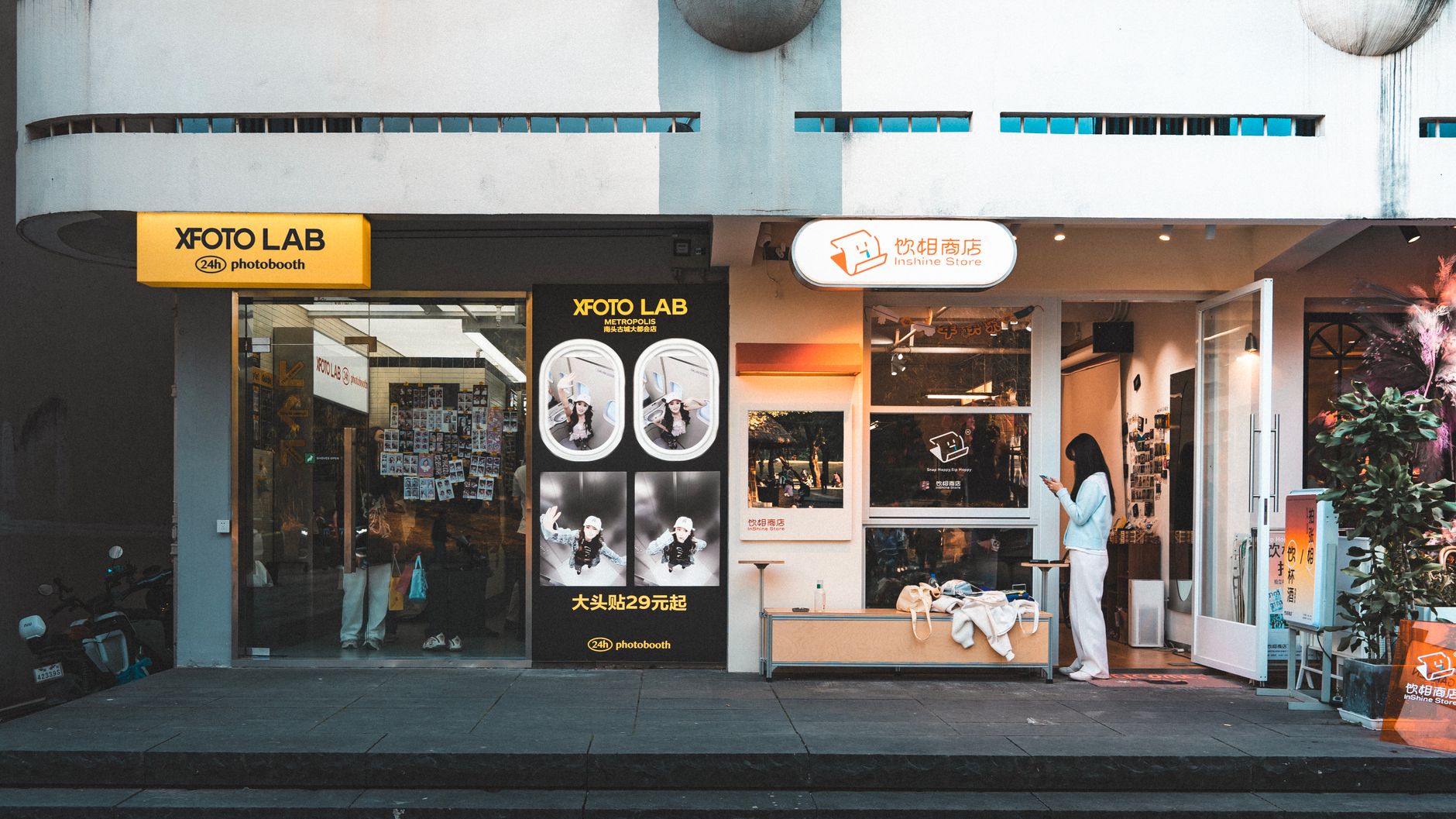 small business owner taking photo of storefront exterior