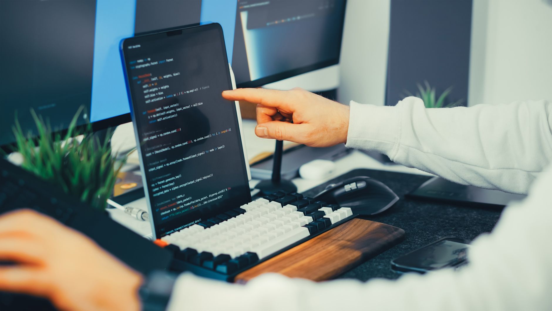 person reviewing text on computer screen
