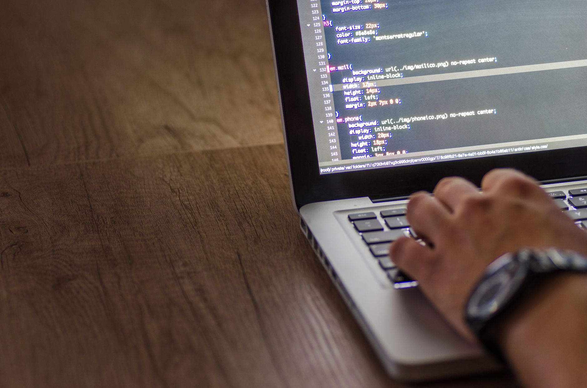 developer working on laptop with cloud interface