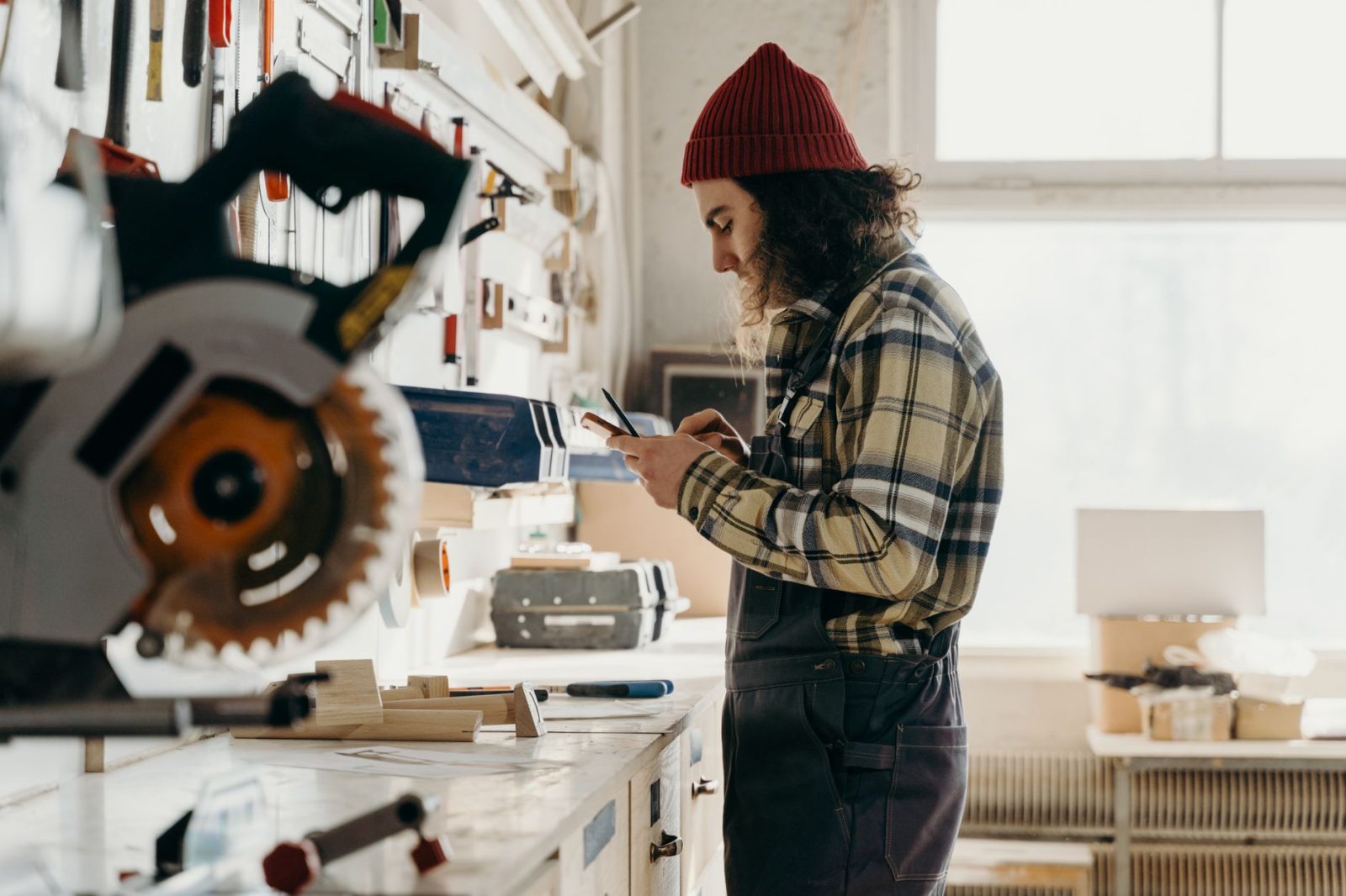 small business owner checking phone for reviews