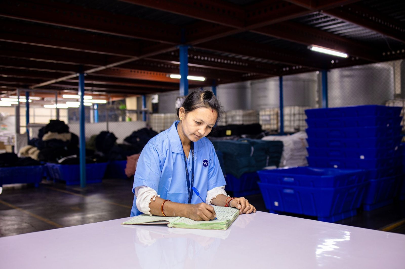 worker checking equipment on mobile app