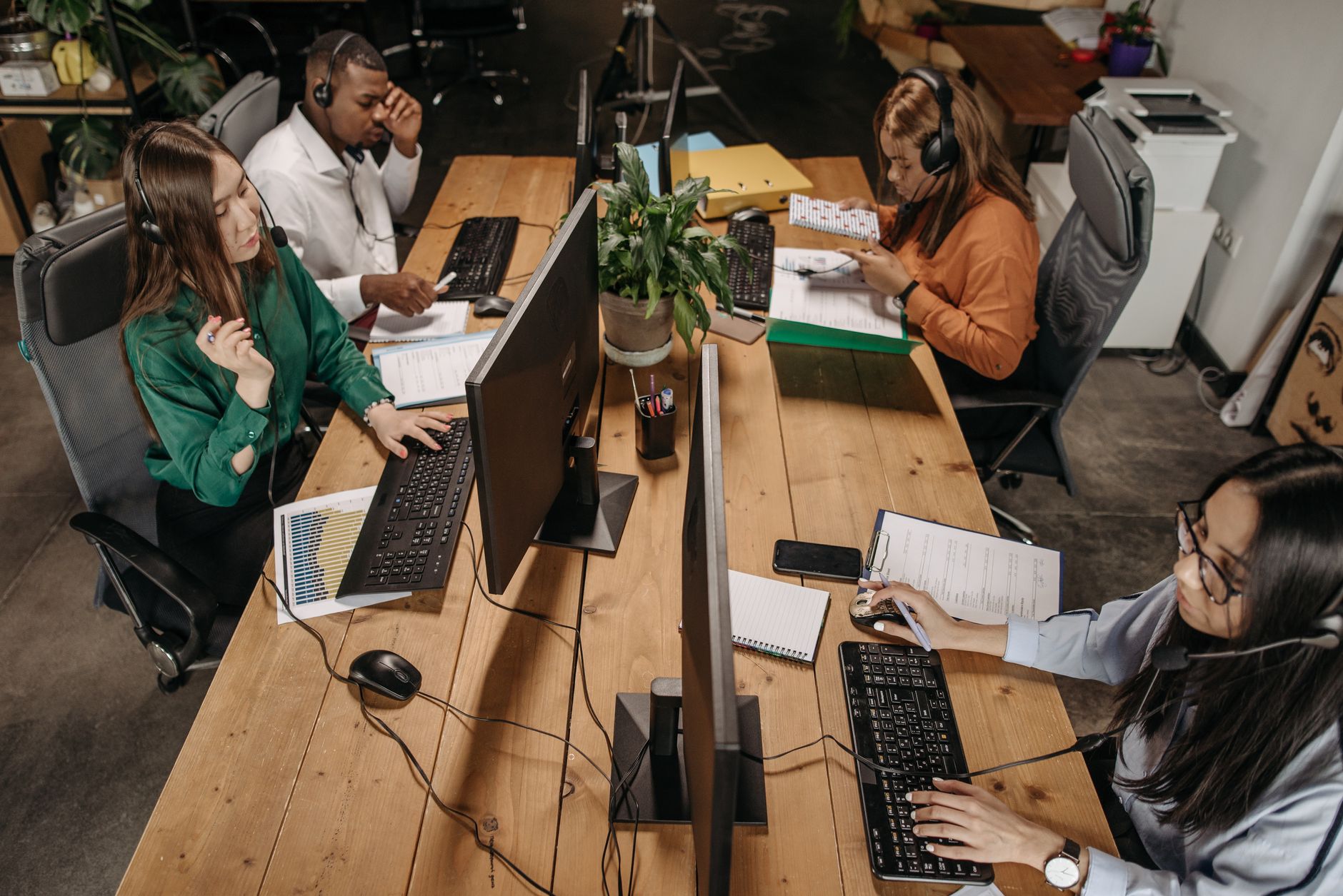office workers collaborating with computer screens